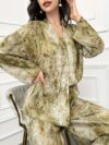 Model showcasing the Newness Effortless Chic Tie Dye Pantsuit a stylish spring ensemble featuring a vibrant tie dye pattern on both the pants and matching blazer The pantsuit exudes effortless sophistication and chic style