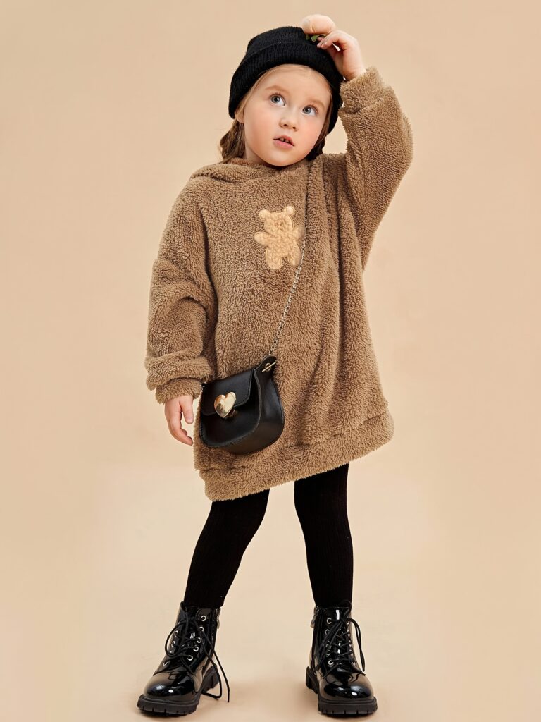 Newness Cuddle Ready Teddy Fleece Hoodie and Leggings Set in soft brown. A child is wearing the set and smiling.