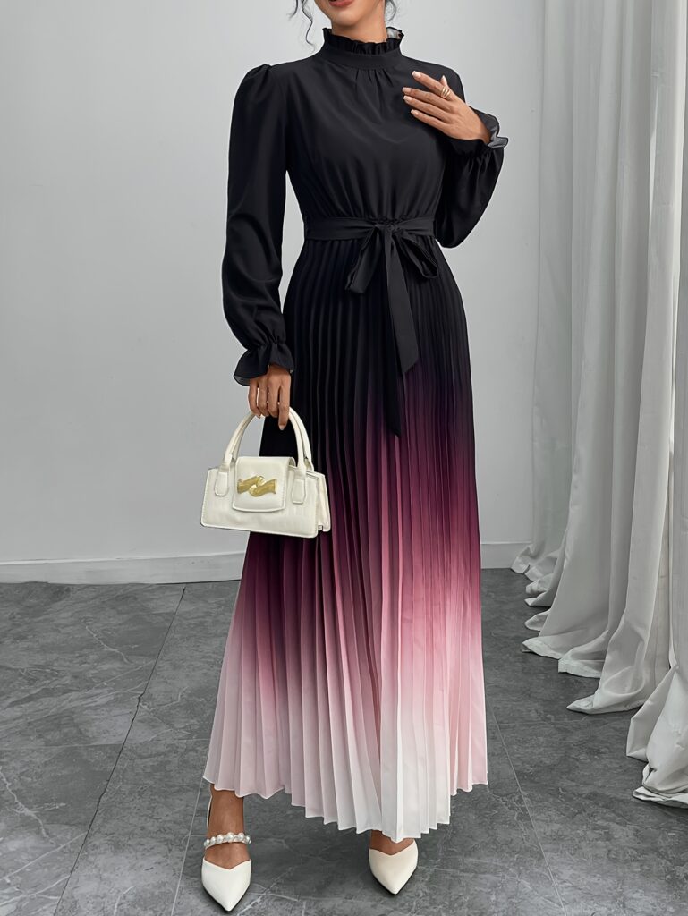 Model wearing a Newness Celestial Hues Ombre Maxi Dress, showcasing a beautiful pink to purple, black, and white gradient. The dress is a floor-length maxi style, perfect for fall/winter events.