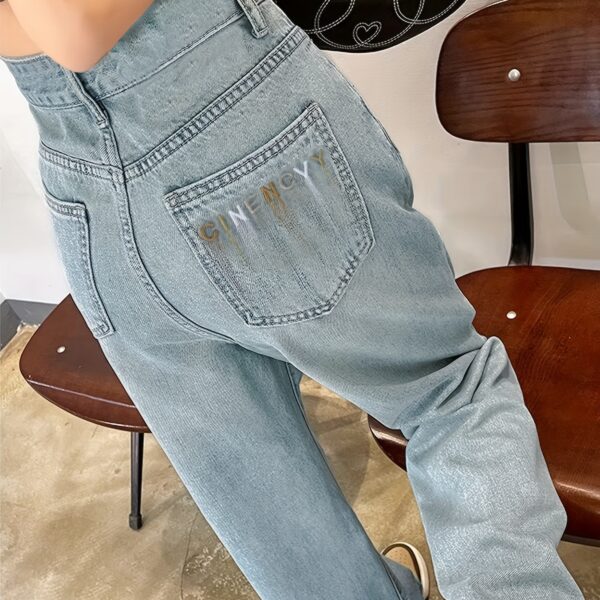 Model wearing Newness Dubai Nights High Waist Wide Leg Jeans showcasing the flattering high waist and wide leg silhouette The jeans are a versatile dark wash perfect for both day and night