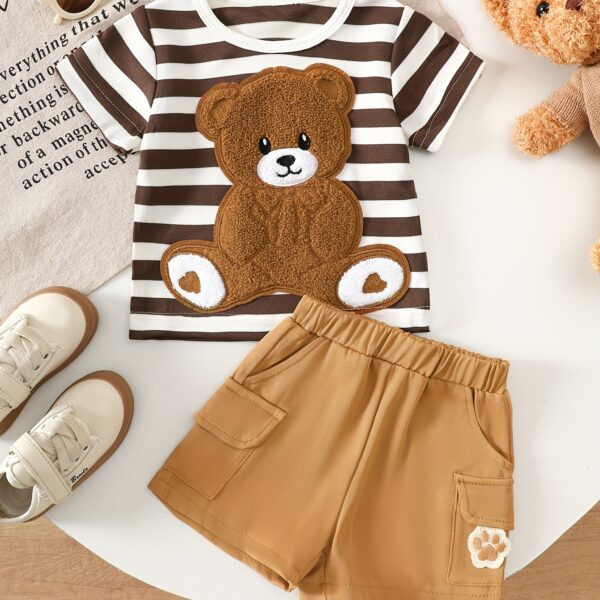 Adorable baby boy wearing Newness Cozy Cub Two Piece Set featuring a striped top with bear embroidery and matching shorts Perfect for spring and summer