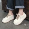 Newness white thick sole sneakers Chic comfortable and effortlessly cool footwear for everyday wear