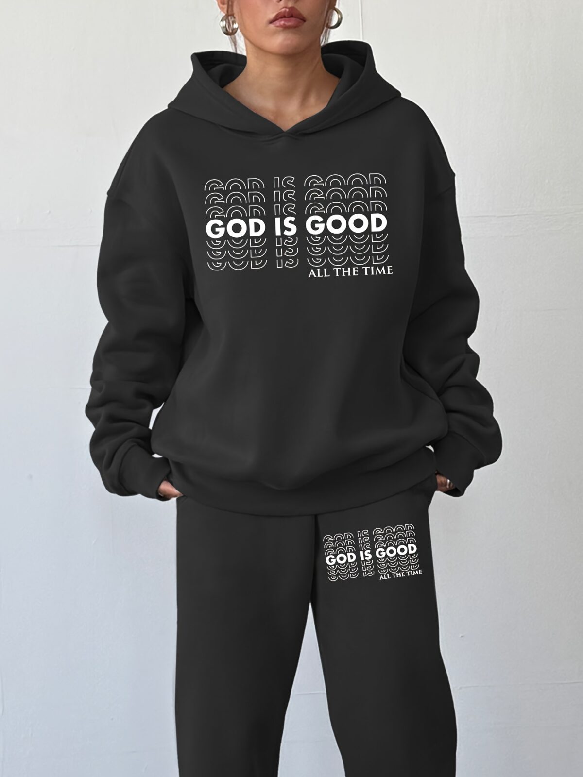 The Newness Minimalist Letter Print Two Piece Set in a cozy autumnal setting A stylish model wears the matching top and pants showcasing the comfortable fit and minimalist letter print Perfect for lounging or a casual day out