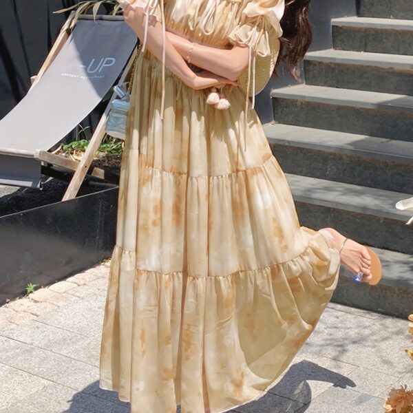 Embrace effortless chic in the Newness Ethereal Bloom Floral Tie-Dye Dress, perfect for summer days and special occasions. This stunning dress features a vibrant floral tie-dye pattern.
