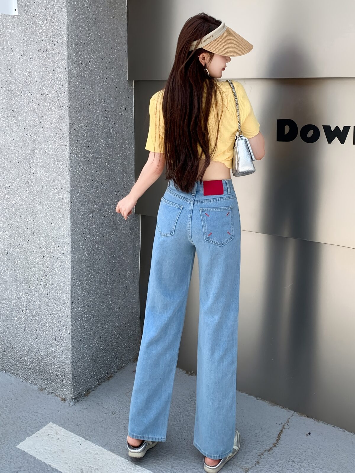 Glacier blue embroidered wide leg jeans from Newness showcasing intricate embroidery and a flattering wide leg silhouette