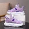 Pastel Pop Girls Low Top Sneakers showcasing the rotating buckle pastel purple and pink checkered and striped design and comfortable cushioned sole
