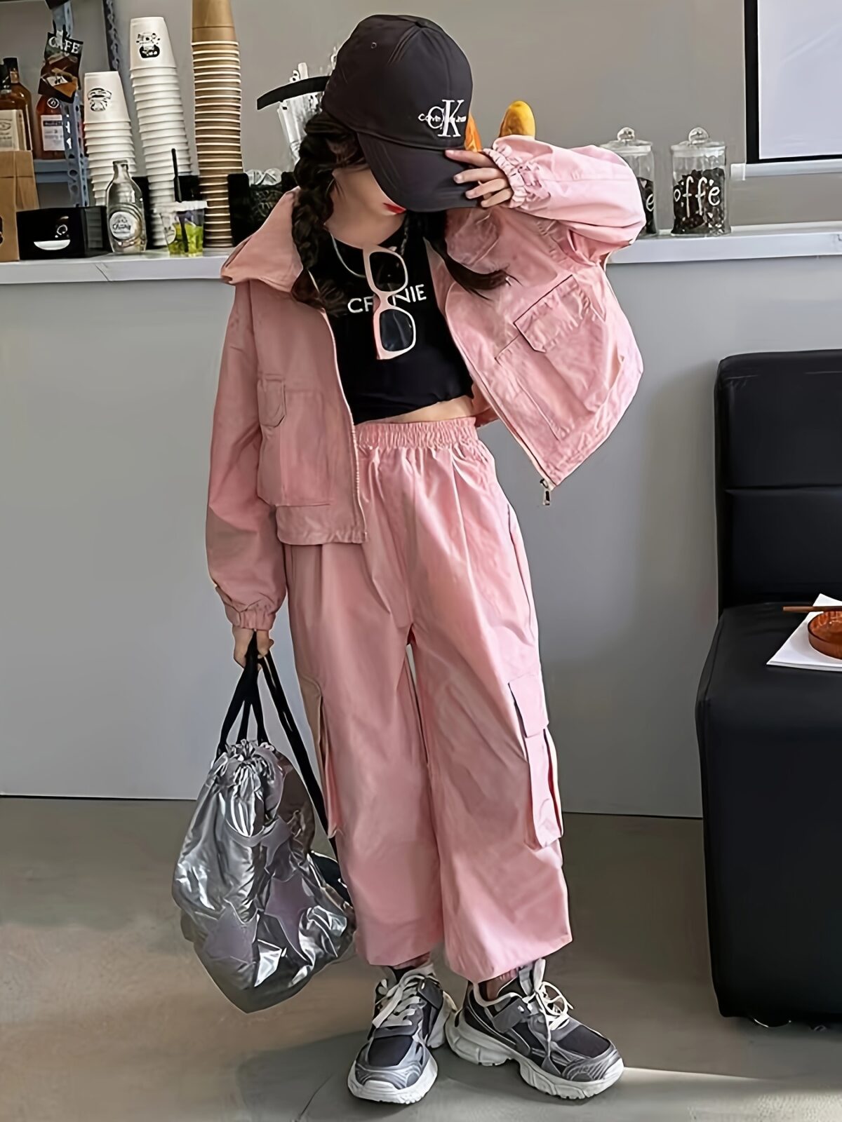 Girl wearing a stylish hooded suit perfect for spring Dubai inspired design