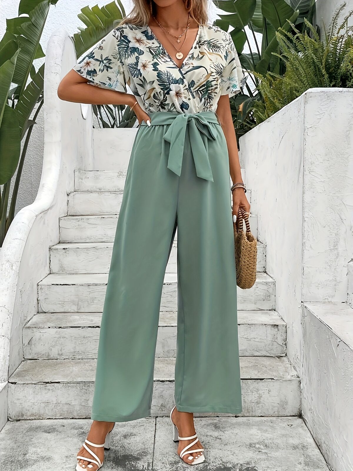 Escape to Paradise Floral Vacation Outfit A chic and comfortable floral outfit perfect for spring getaways Model shown wearing the complete outfit including mention specific items like dress shorts top etc showcasing its breezy and stylish design
