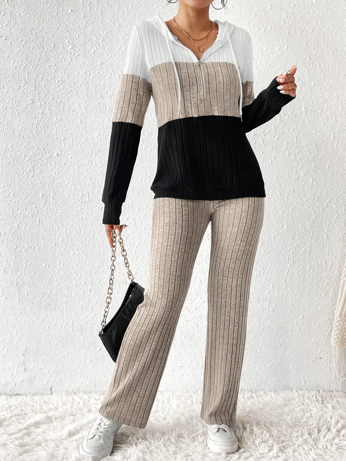 The Newness Riviera Color Block Hoodie Set in a flattering pose showcasing its vibrant color blocking and comfortable fit Perfect for spring or fall
