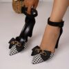 Newness Chic Houndstooth Block Heels with Bowknot Detail Stylish pointed toe sandals in a classic houndstooth pattern featuring a comfortable block heel and elegant bowknot accent
