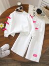 Adorable girls two piece autumn outfit cozy knit top and loose fitting pants perfect for fall adventures Dubai design