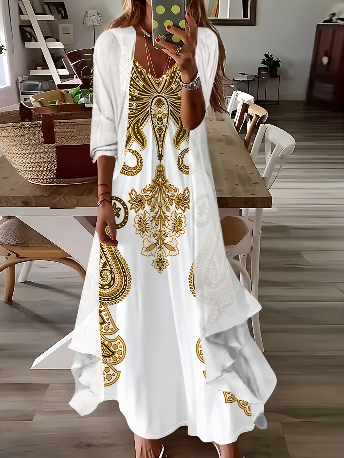 Stylish woman wearing the Newness Dubai Escape Paisley Vacation Dress Set posing against a backdrop of a luxurious Dubai hotel or resort The dress is a vibrant paisley print flowing elegantly