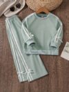 Girl wearing a stylish and comfortable two piece sweatpants set in soft stretchy fabric Perfect for everyday wear