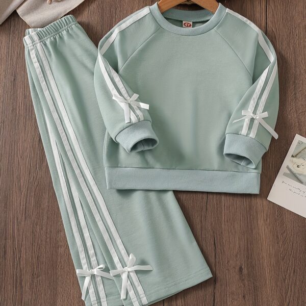 Girl wearing a stylish and comfortable two piece sweatpants set in soft stretchy fabric Perfect for everyday wear