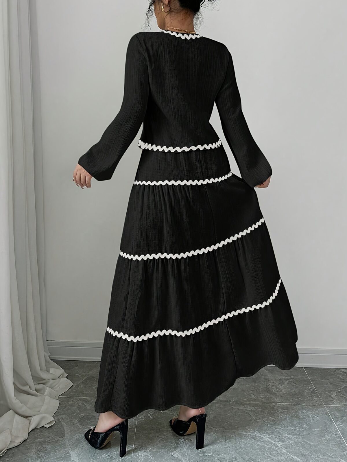 Effortlessly chic Casablanca Tiered Maxi Skirt Set from Newness Model showcasing the complete set featuring a flowing maxi skirt with tiers and a coordinating top