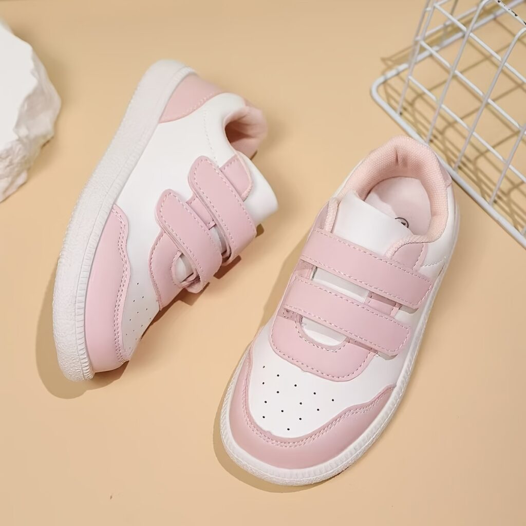 Youthful Stride Kids' Breathable Sneakers in action, showcasing their comfort and style with adjustable straps and breathable design. A child's foot is shown wearing the shoe, highlighting the breathable upper and TPR sole.