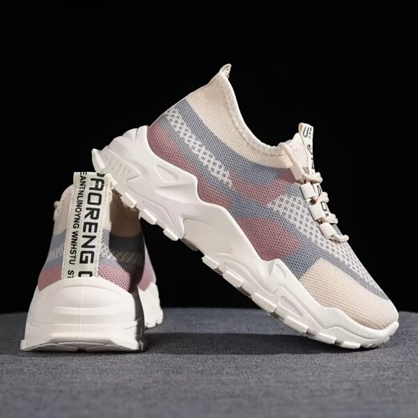 Newness Womens Breathable Mesh Casual Sneakers Newness Bangladesh Pair of womens breathable mesh casual sneakers in white low top design with lace up closure and soft knit insole