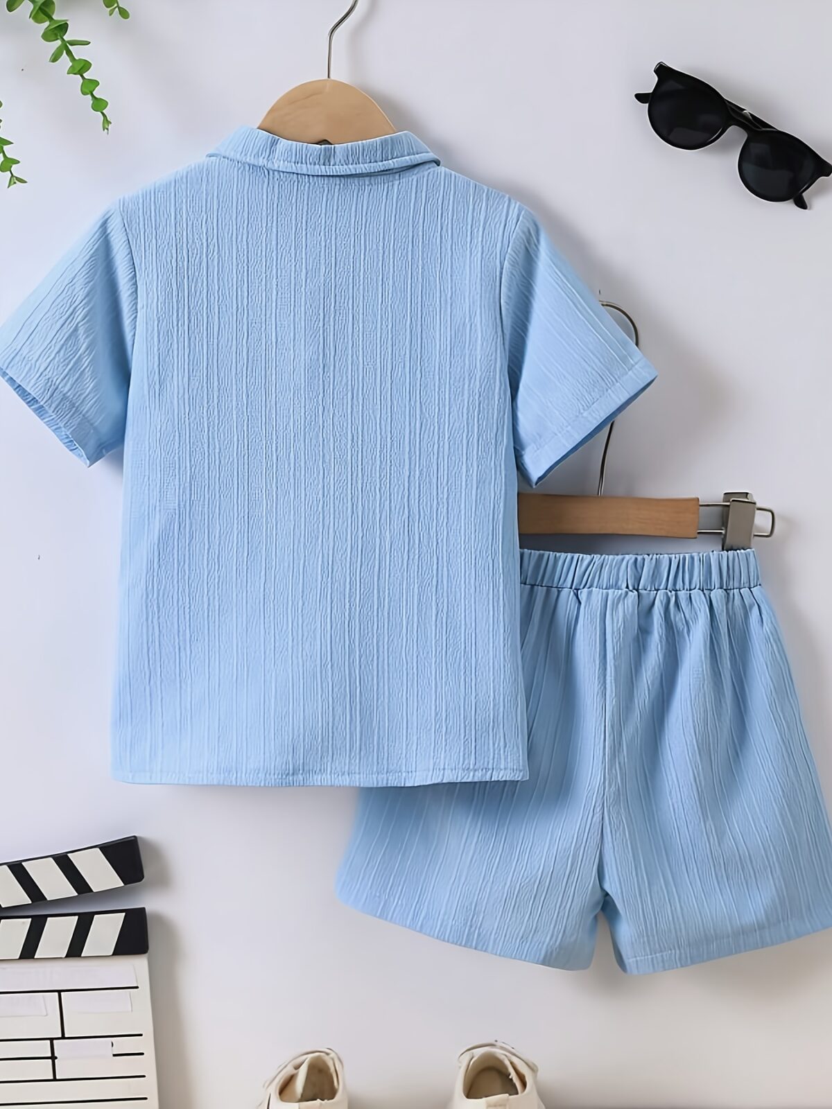 Adorable boy playing outdoors wearing the Newness Summer Breeze Boys Casual Short Set The set is comfortable and perfect for playtime