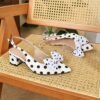 Classic black and white polka dot pumps from Newness perfect for adding a retro touch to any outfit