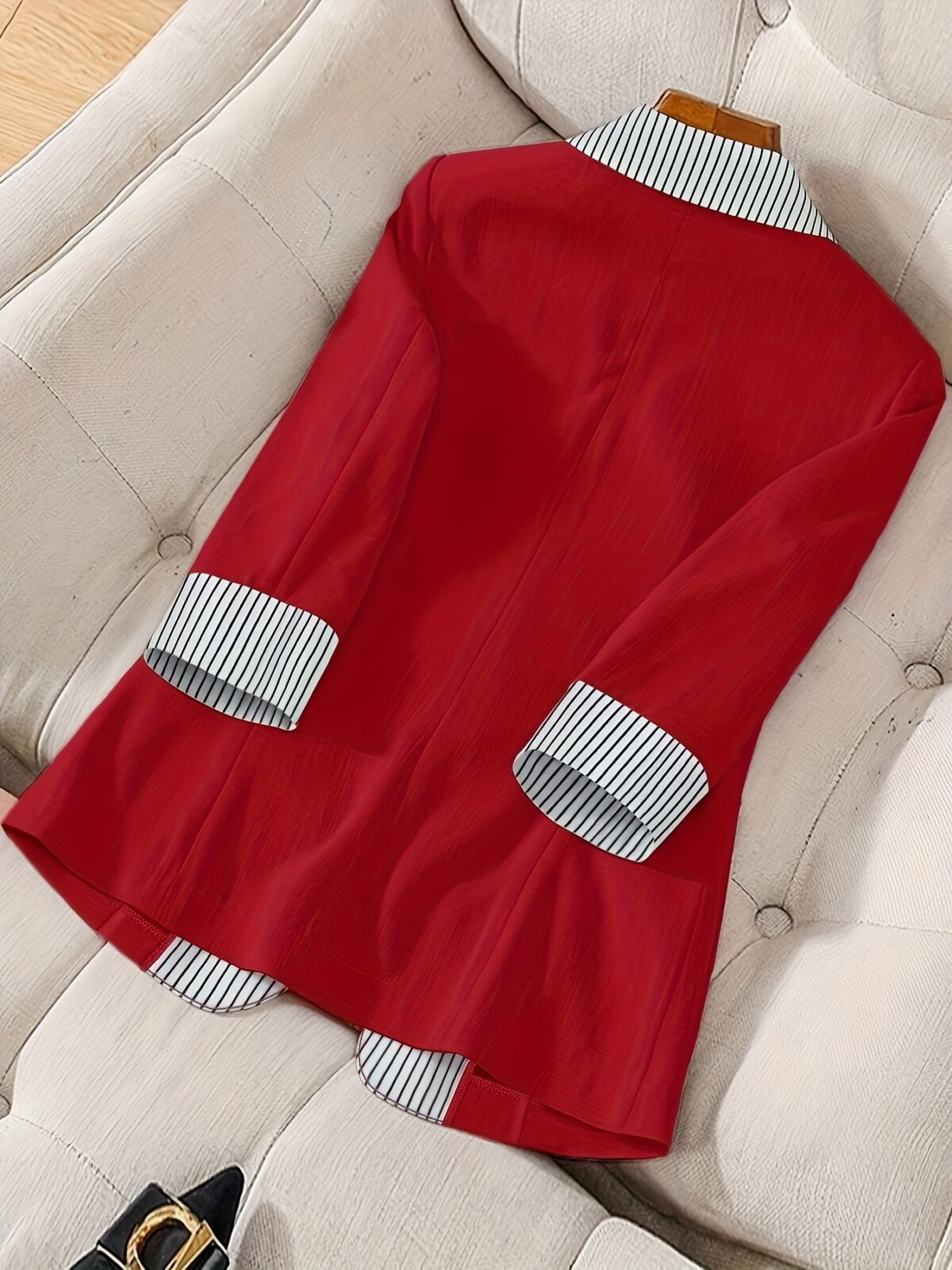 Stylish womens red and white striped blazer perfect for casual or office wear Features a single button closure and a flattering regular fit