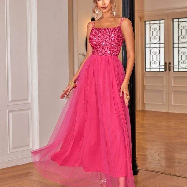 Dazzle in our Evening Sparkle Pink Sequin Evening Gown. This stunning off-the-shoulder gown features shimmering sequins and elegant tulle, perfect for your next formal event.