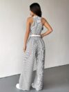 The Newness Riviera Striped Trouser Set in a flattering pose showcasing its relaxed fit and chic style Model is wearing the matching top and trousers
