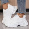 White womens chunky sneakers with geometric embroidery thick sole and lace up closure