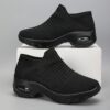 Womens black slip on sneakers with breathable knit upper comfortable wedge heel and cushioned sole