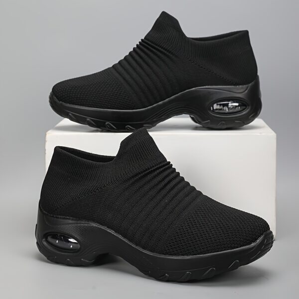 Black Womens SlipOn Knit Sneakers with Wedge Heel Newness Bangladesh Womens black slip on sneakers with breathable knit upper comfortable wedge heel and cushioned sole
