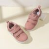 Kids pastel pink white black blue and grey low top sneakers with arch support Durable rubber soles and cushioned insoles provide all day comfort
