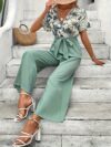 Escape to Paradise Floral Vacation Outfit A chic and comfortable floral outfit perfect for spring getaways Model shown wearing the complete outfit including mention specific items like dress shorts top etc showcasing its breezy and stylish design