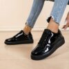 Newness Sleek  Chic Womens Glossy Sneakers in white showcasing their glossy finish and comfortable design Perfect for effortless style