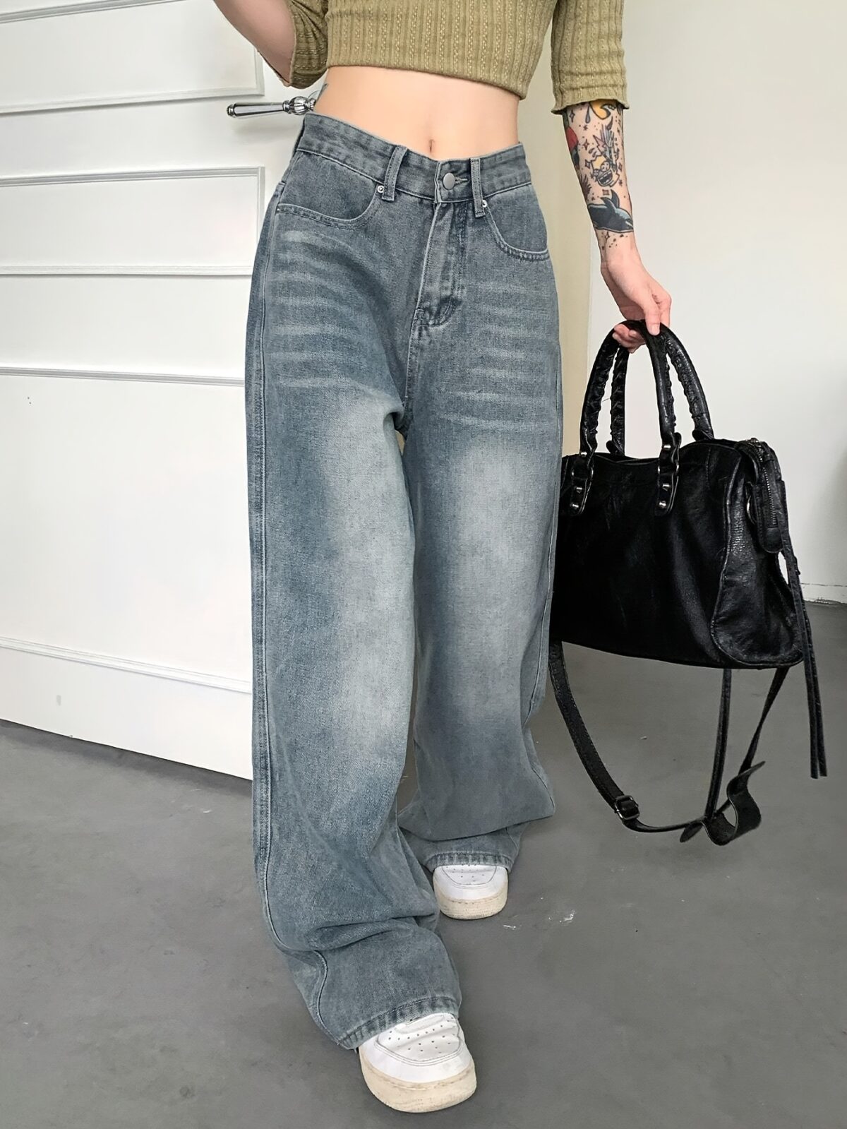 Newness Parisian High Waisted Wide Leg Jeans Flattering comfortable wide leg jeans in a chic style Model wearing light wash denim
