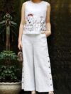 The Newness Botanical Embroidered Vest Suit in a flattering pose Showcasing the intricate embroidery and chic design