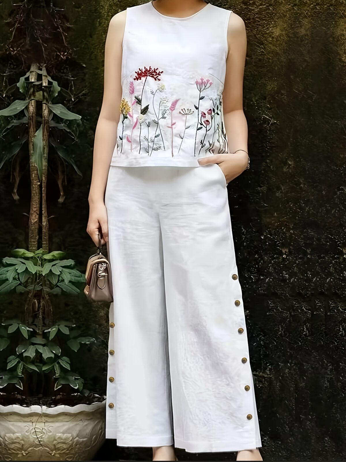 The Newness Botanical Embroidered Vest Suit in a flattering pose Showcasing the intricate embroidery and chic design