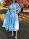 Embrace Parisian chic in the Newness Azure Bloom Floral Print Dress This stunning summer dress features a vibrant floral print