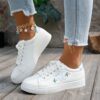 Newness Blush Butterfly Lace Up Sneakers Chic blush colored sneakers with butterfly accents and lace up closure perfect for spring