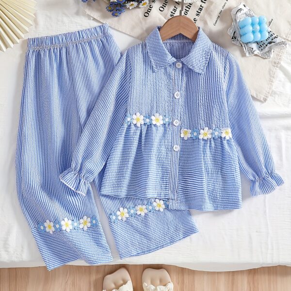 Adorable girl wearing Newnesss Whimsical Bloom Girls Floral Outfit a charming two piece set with a stylish top and flared pants perfect for spring or fall