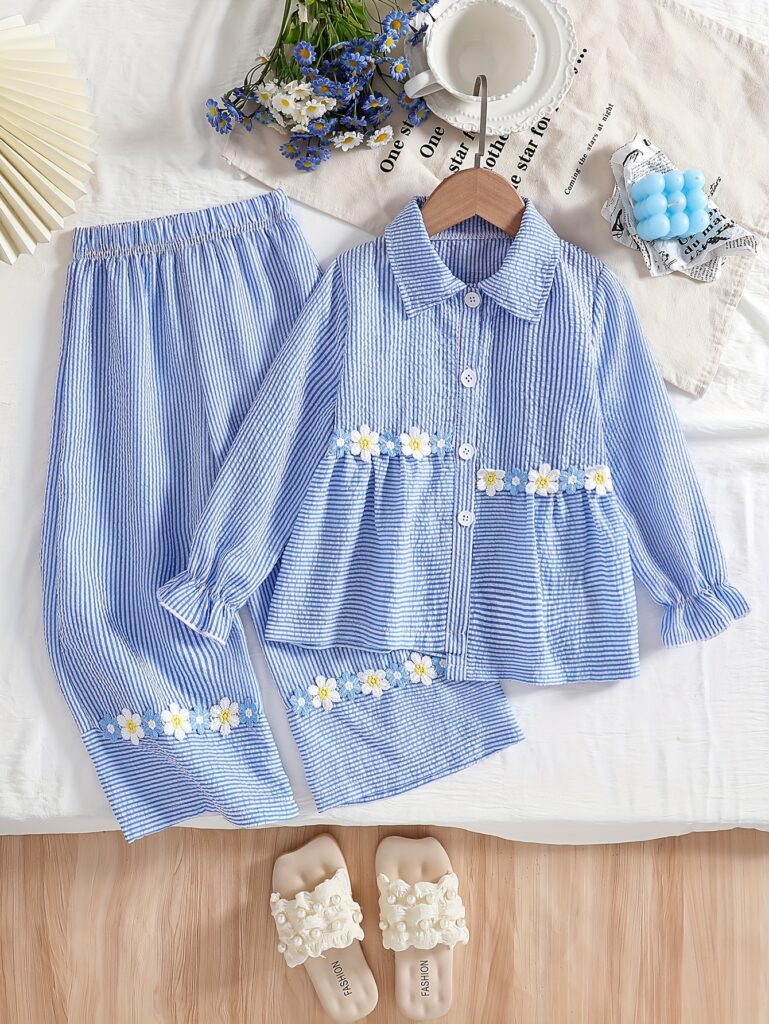 Adorable girl wearing Newness's Whimsical Bloom Girls Floral Outfit, a charming two-piece set with a stylish top and flared pants, perfect for spring or fall.