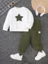 Adorable boy modeling the Newness Cozy Comrade 2 Piece Set featuring a beige star embroidered sweatshirt and matching corduroy cargo pants Perfect for fall and winter