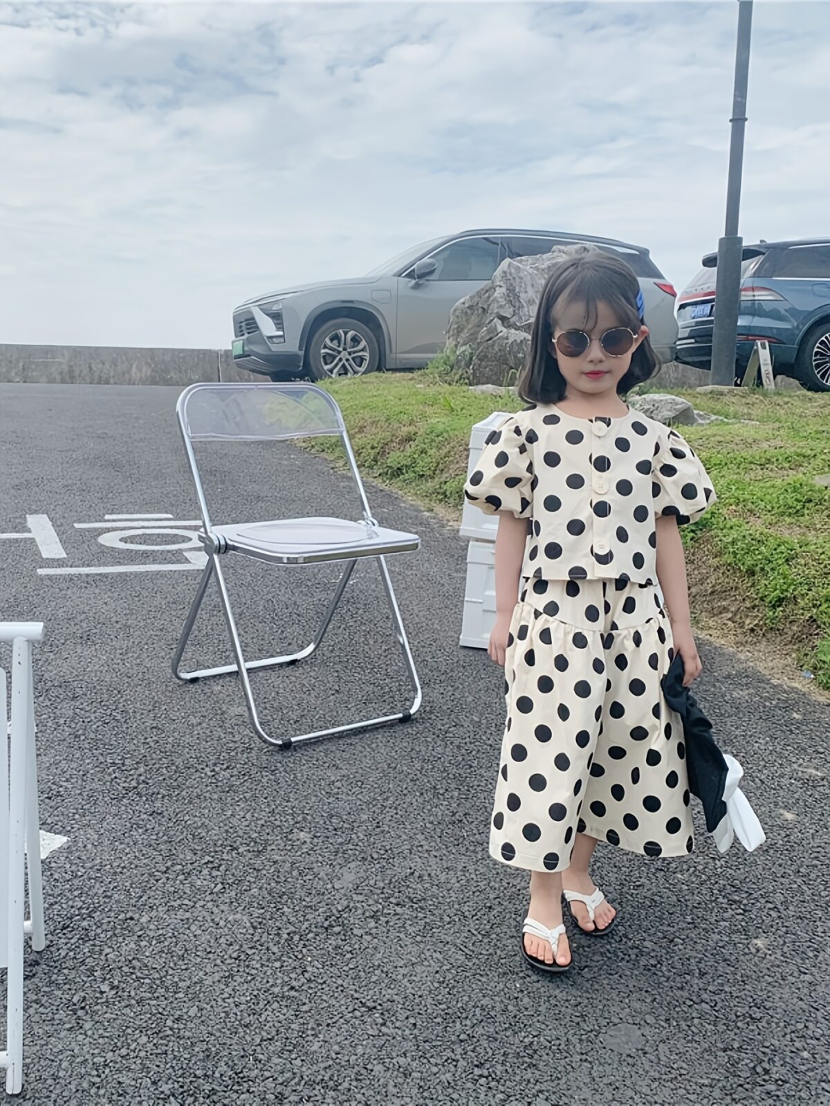Adorable girls polka dot suit perfect for summer made from 100 soft cotton The suit features a mention specific details like sleeveless top and shorts or skirt design