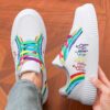 Newness Rainbow Burst Sneakers Chic comfort redefined A pair of vibrant rainbow striped sneakers showcasing their stylish design and comfortable fit