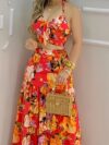 Model wearing the Newness Dubai Nights Tropical Print Suit a chic and effortless summer outfit perfect for a getaway The suit features a vibrant tropical print