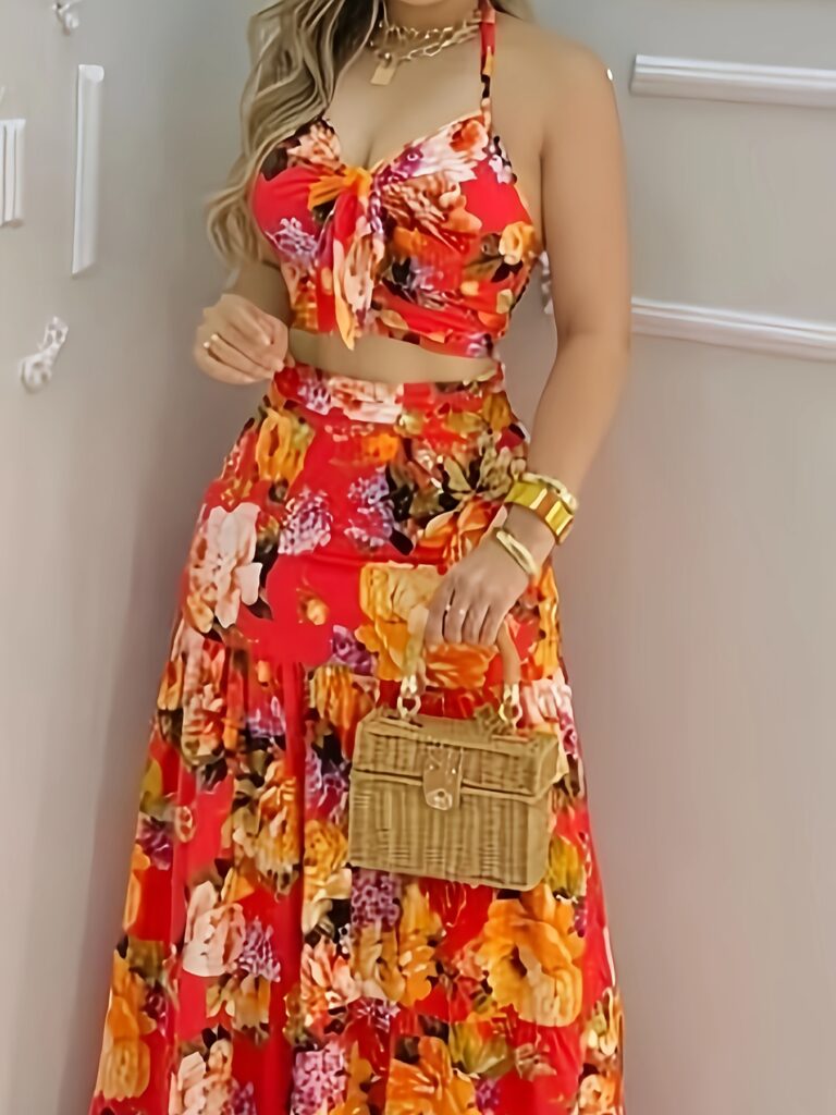 Model wearing the Newness Dubai Nights Tropical Print Suit, a chic and effortless summer outfit perfect for a getaway. The suit features a vibrant tropical print.