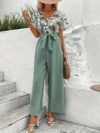 Escape to Paradise Floral Vacation Outfit A chic and comfortable floral outfit perfect for spring getaways Model shown wearing the complete outfit including mention specific items like dress shorts top etc showcasing its breezy and stylish design