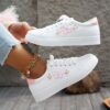 Newness Blush Butterfly Lace Up Sneakers Chic blush colored sneakers with butterfly accents and lace up closure perfect for spring