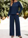 The Newness Milan Solid Color Pantsuit in a flattering pose This chic pantsuit crafted from smooth polyester is perfect for spring and fall The model showcases its versatile style and sophisticated fit