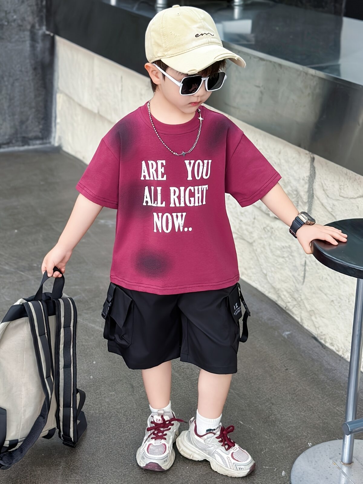 Stylish boys summer outfit alphabet print t shirt and cargo shorts set from Newness Perfect for summer adventures