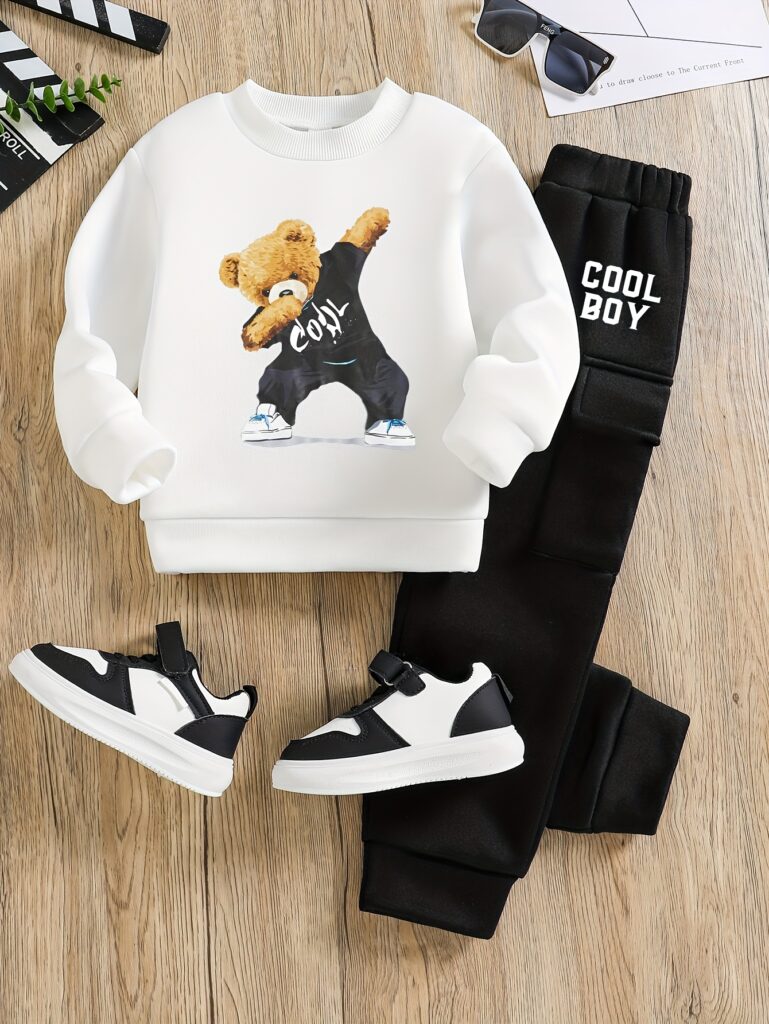 Stylish boys' black and white graphic pullover sweatshirt and comfortable sweatpants set, perfect for fall and winter. Cozy and trendy for casual outings or lounging at home.