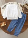 Stylish boys outfit long sleeve solid color top and ripped faux denim jeans perfect for spring and fall
